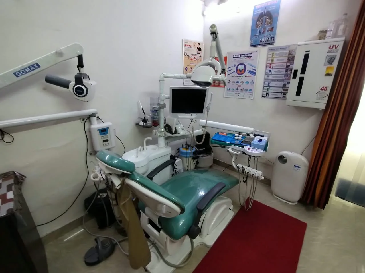 Dental chair beside the clinic's digital dental X-ray unit at Dent-O-Care