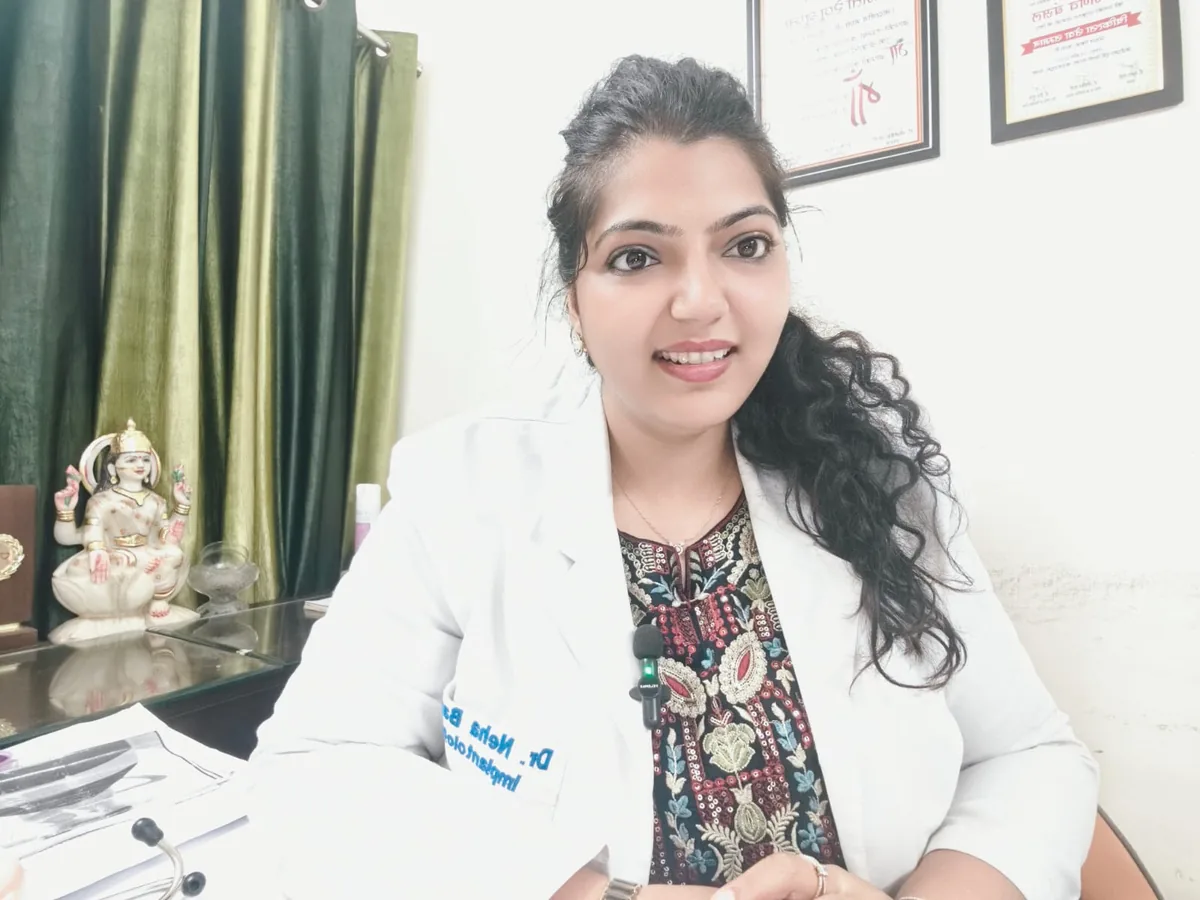 Dr. Neiha Bansal at her desk at Dent-O-Care