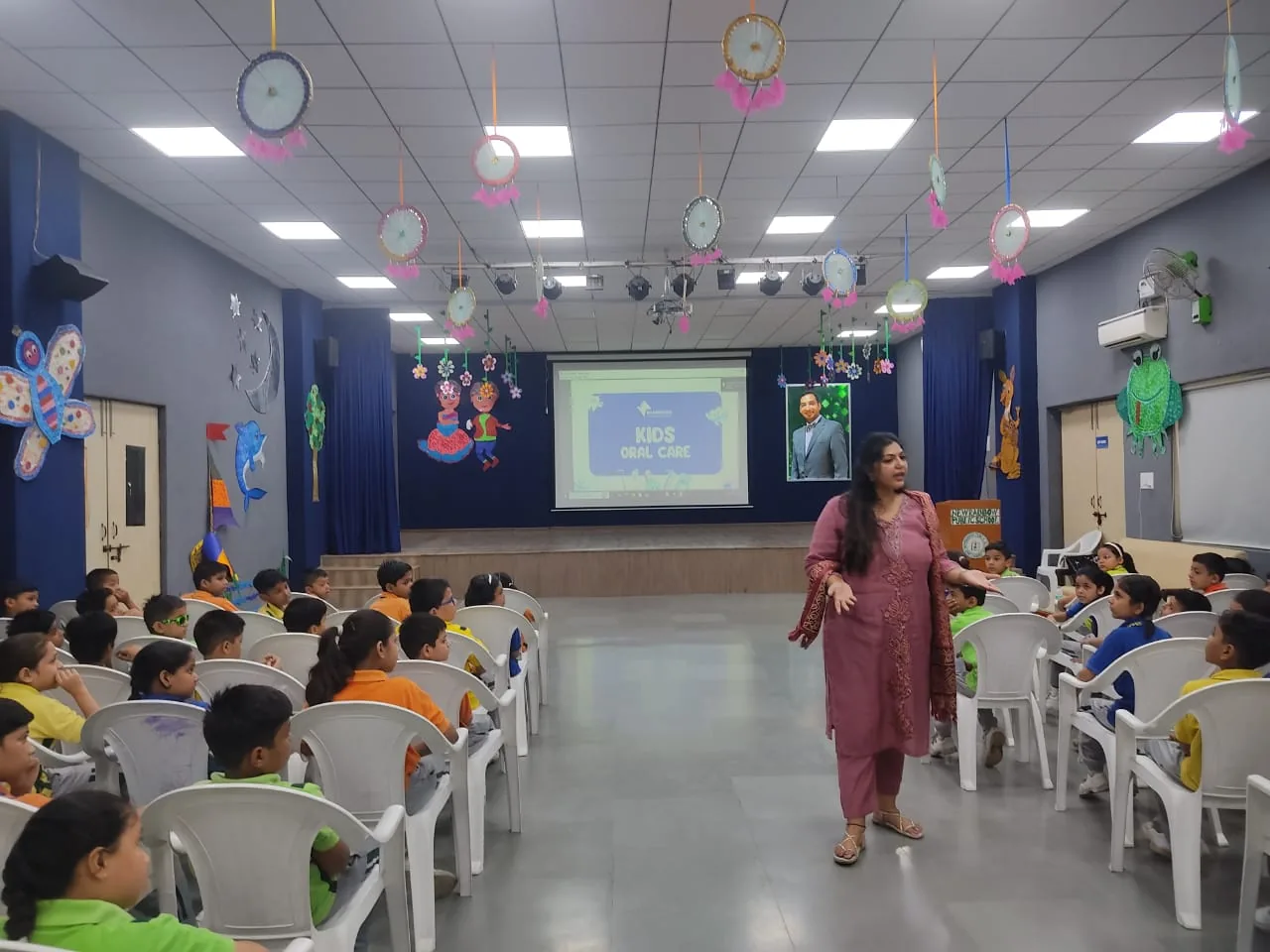 Dr. Neiha Bansal leading a dental awareness session for school students